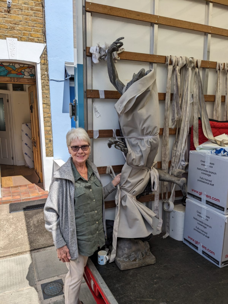 Our client with a fragile statue, packed with care by our Loughborough removals team.
