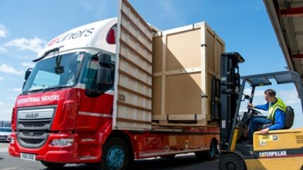 A storage container is loaded on to a GB Liners vehicle